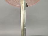 an image of a table lamp with a pink glass shade on it
