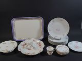 a lot of plates and bowls on the table
