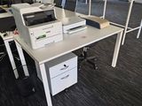 a white desk with a printer on it in an office