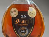 an image of a bottle of brandy sitting on top of a table