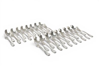 a lot of silver spoons and forks on a white surface