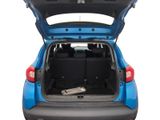the back end of a blue car with its trunk open
