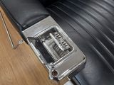 an image of a black leather chair in a barber shop
