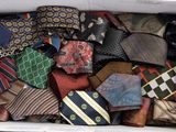 a box full of ties that are sitting on a table