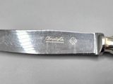 a knife that is sitting on top of a table