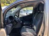 the interior of a car with the door open and the driver ' s seat down