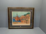 tableau encadré représentant un bateau dans un port