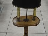 a lamp that is sitting on a stand in a room
