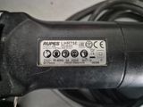 a close up of a black corded electric driller