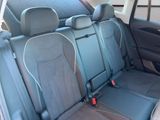 the back seats of a car with two rows of seats in it