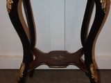 a small table with a clock on top of it