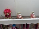 a shelf that has a lot of bottles and candles on it
