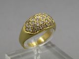 an image of a gold and diamond ring sitting on top of a clear display case