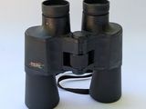 a pair of binoculars sitting on a white surface