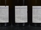 three bottles of wine that are on a table