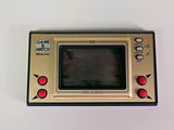 an old game console sitting on top of a white table