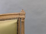 an image of a chair with a gold upholstered back and gold upholstered seat