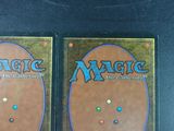 two decks of magic the gathering cards on a table