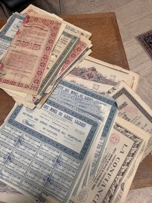 a pile of old papers sitting on a table