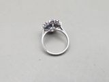 a ring that has three stones in it on a table