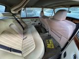 a view of the inside of a car from the driver ' s seat