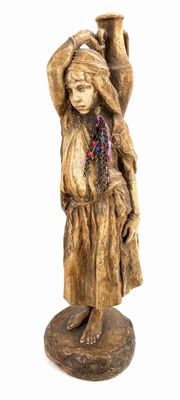 statue of a woman holding a pot on her head