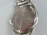 an image of a close up of a wrist watch on a table
