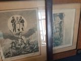 two framed pictures on the wall of a room