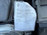 a sign on the engine of a car that is under the hood