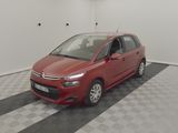 the red citrole is parked on a checkered floor in a garage