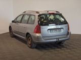 a silver car parked in a room with a checkered floor