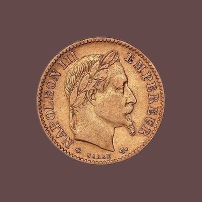 gros plan d'une pièce d'or sur laquelle figure le visage d'un homme