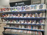 a lot of video games on the shelves in the store