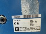 a label on the back of a machine that is blue