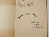 an open book with writing on it sitting on top of a table