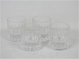 three clear glass tumblers sitting on a white surface