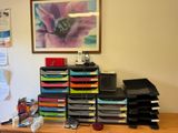 a picture of a cluttered desk with a bunch of papers on it