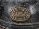 a close up of a black and gold fire hydrant