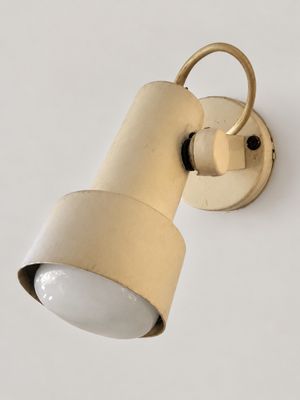 a close up of a light on a wall with a white background