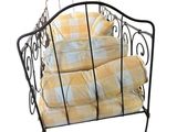 a metal bed with a yellow and white checkered blanket on it