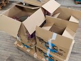 several cardboard boxes are stacked on top of each other on the floor