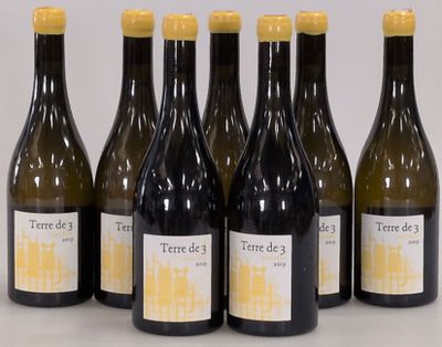 six bottles of wine sitting next to each other on a table