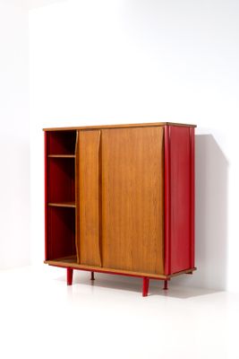 an image of a red cabinet against a white wall