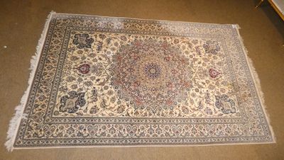 an oriental rug on the floor in a room with a chair