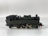 a toy train on a white surface with a white background