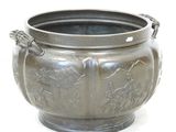 a silver pot with a handle on a white background