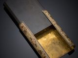 an image of a book opened on a black surface