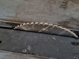 a piece of wood that has been cut with a circular saw