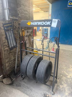 a rack with tires on it in a garage