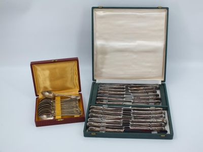 a box of silver spoons and a box of silver spoons